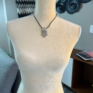 Silver tone necklace.